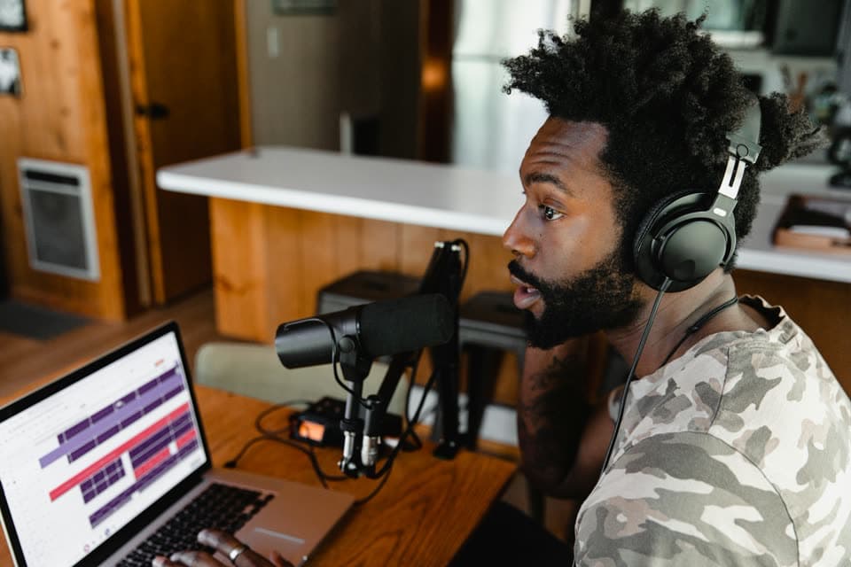 A creator speaking from a studio